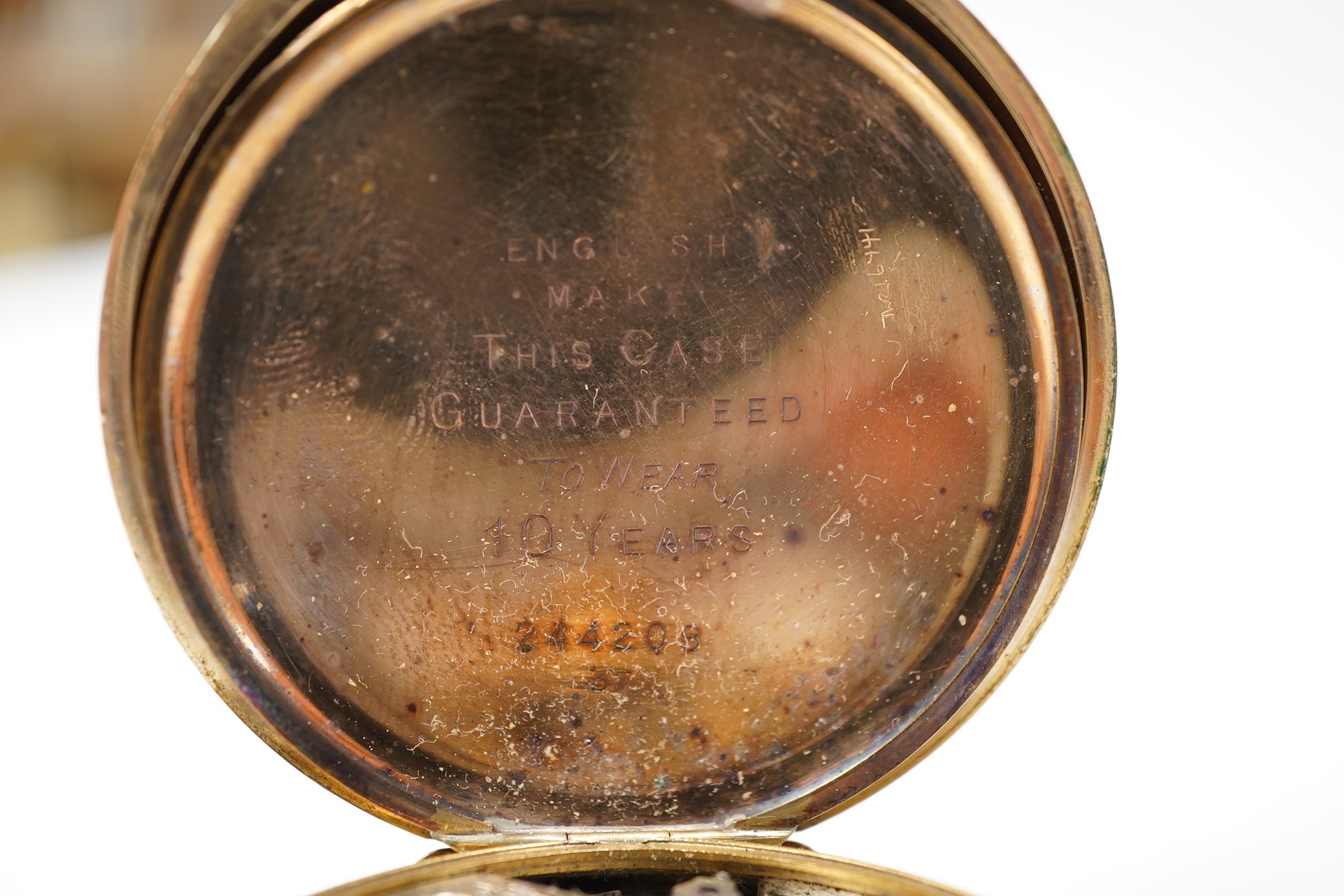 A gold plated Vertex hunter pocket watch and a George V silver mounted glass desk timepiece, with pig finial, height 95mm. Condition - poor.